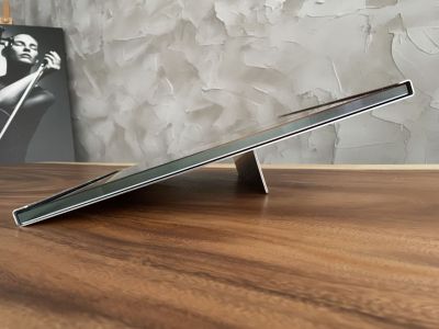 Glass plate with a photo in a stainless steel stand