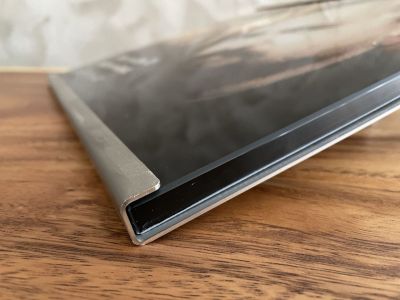 Glass plate with a photo in a stainless steel stand