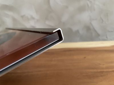 Glass plate with a photo in a stainless steel stand