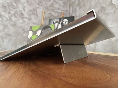 Glass plate with a photo in a stainless steel stand