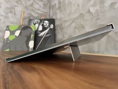 Glass plate with a photo in a stainless steel stand